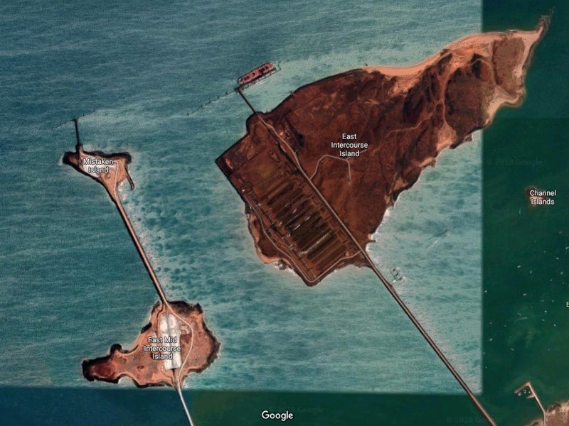  Pictured: the export facilities at Dampier. Upper right are the iron export stockpiles, to the left are the salt export stockpiles.  Photo: Google Earth.  