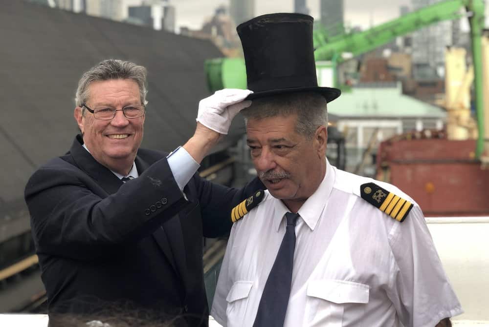  Toronto haror Master Emeritus Angus places a ceremonial top hat on Captain Pero Mikelic of the M/V Cape. Photo: Nate tabak 