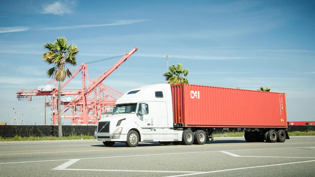 Truck moving a CAI container