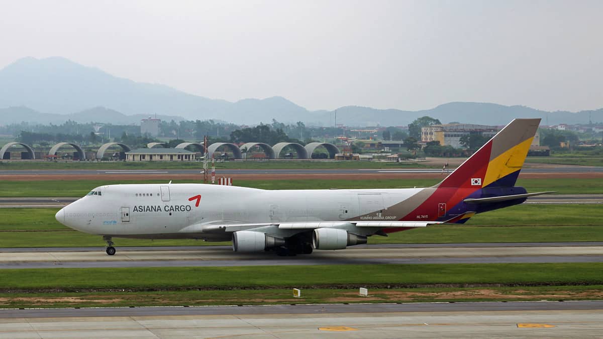 An Asiana jumbo jet on taxiway at Hanoi Airport