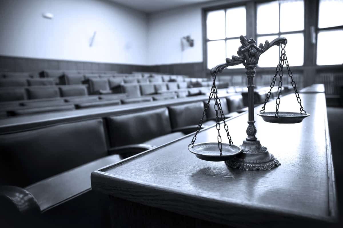 Pictured: scales, a symbol of law and justice. Photo: Shutterstock.