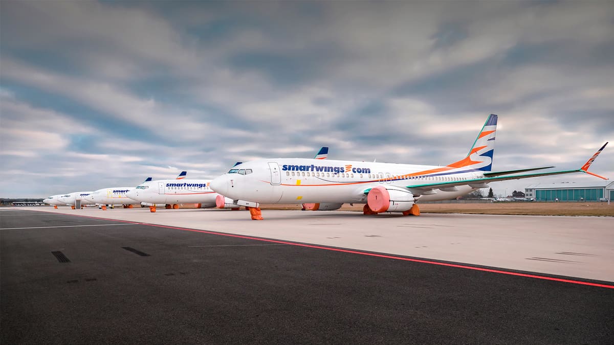 Airplanes parked with engine covers.