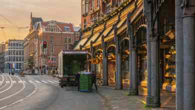 A truck makes a delivery in Amsterdam.