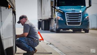 Worker repairing truck