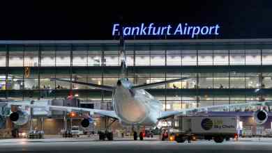 Rear view of plane parked at gate at Frankfurt Airport, nighttime