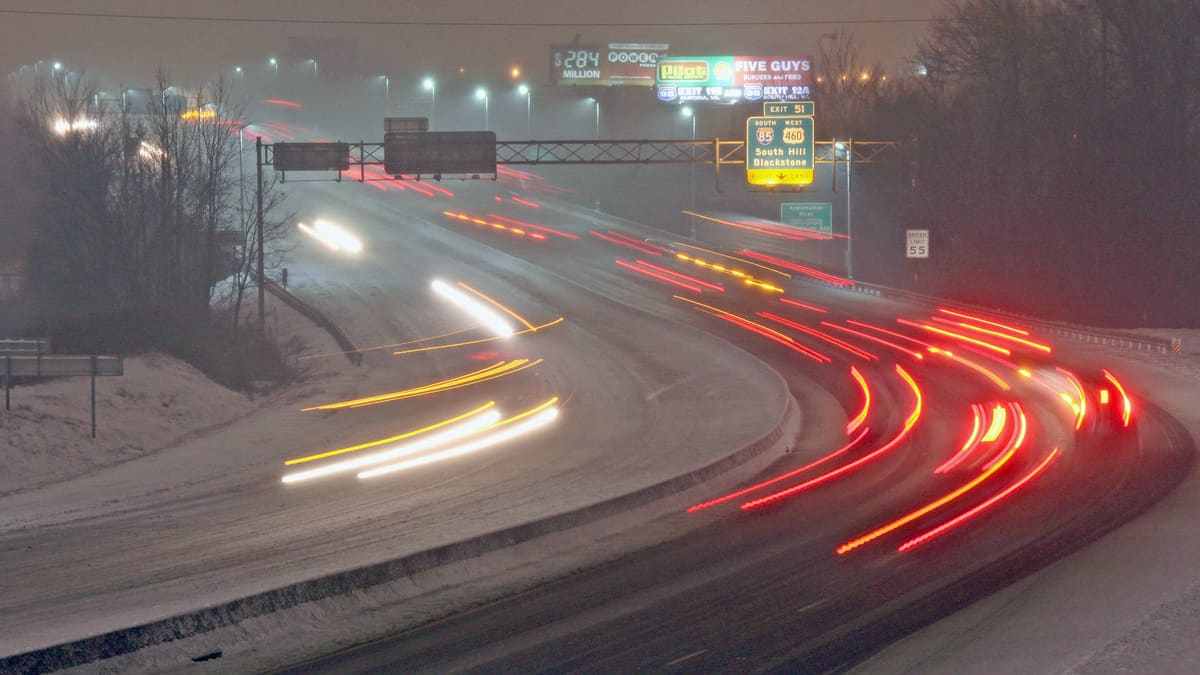 Vehicles on a snowy Virginia highway.