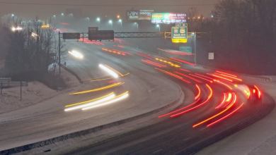 Vehicles on a snowy Virginia highway.
