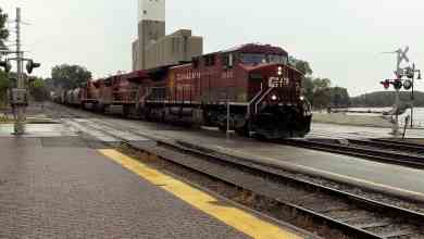 A photograph of a train at a station.