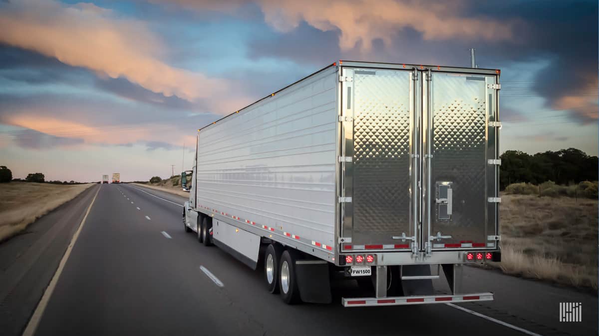 unidentified tractor trailer moving down highway