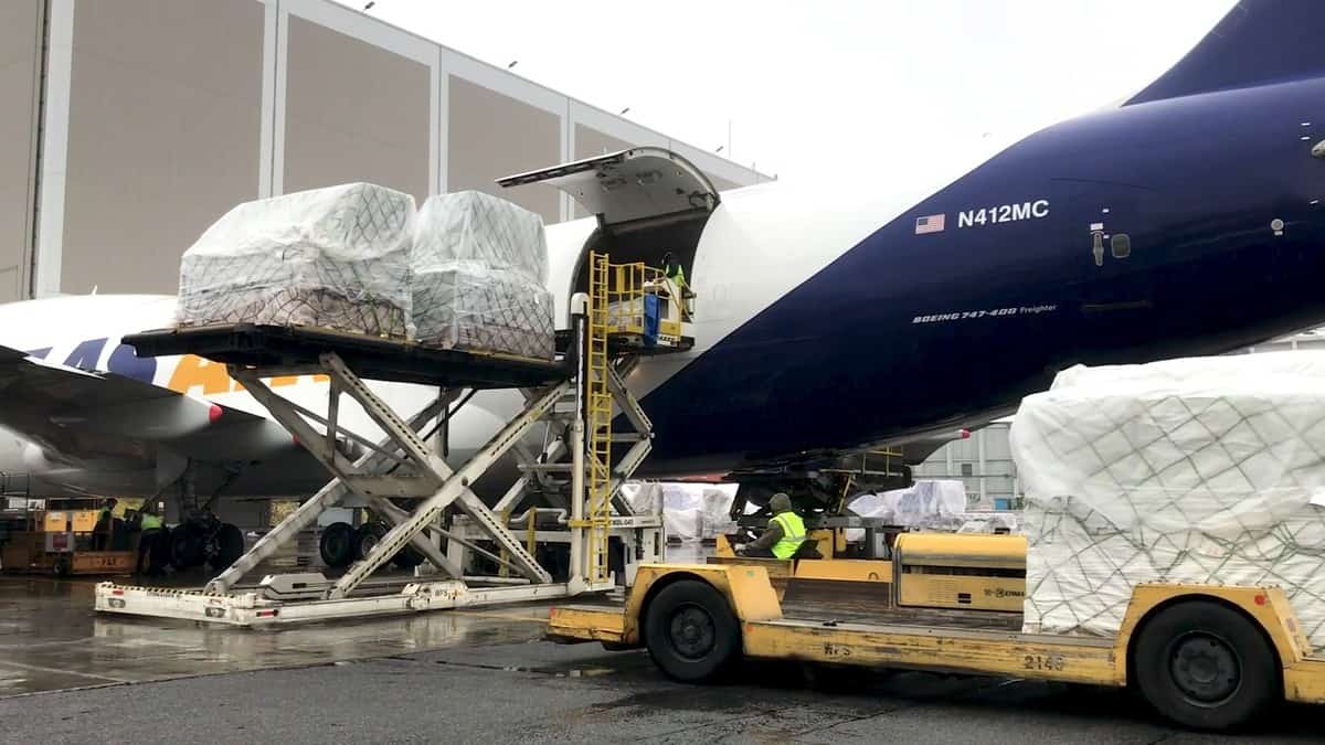 A big 747 jumbo jet offloads cargo at JFK Airport