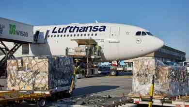 A Lufthansa plane gets loaded with cargo.