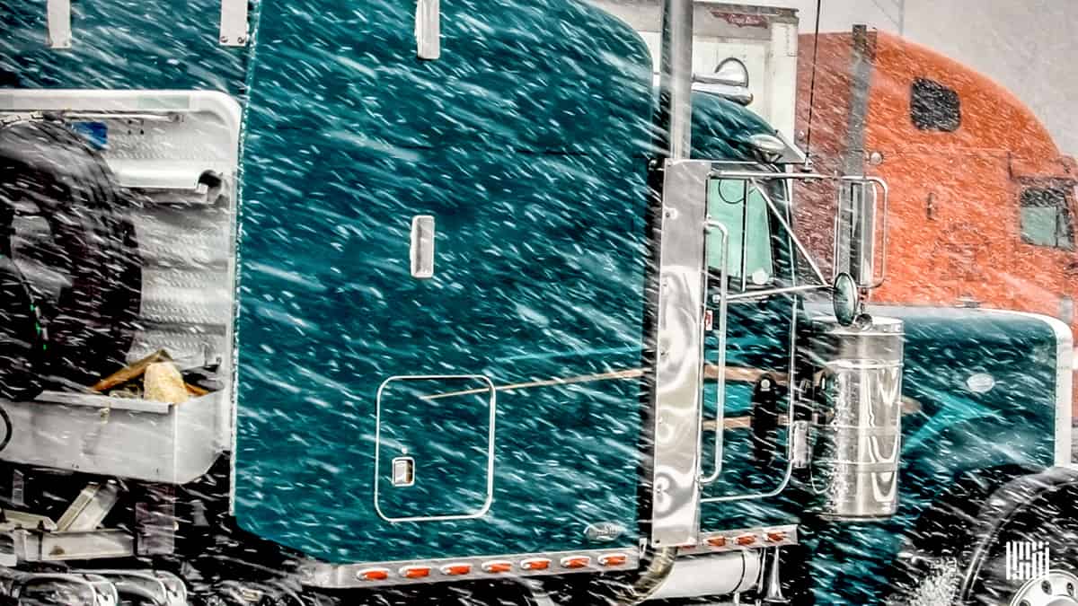 Tractor-trailer in heavy snowfall.