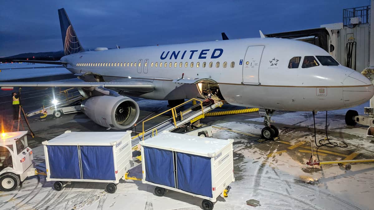 United Airlines plane gets loaded with baggage.