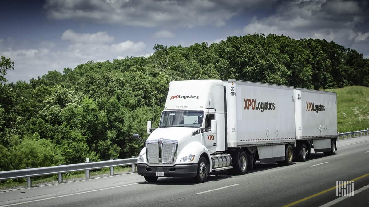 XPO LTL tractor and two pup trailers on road