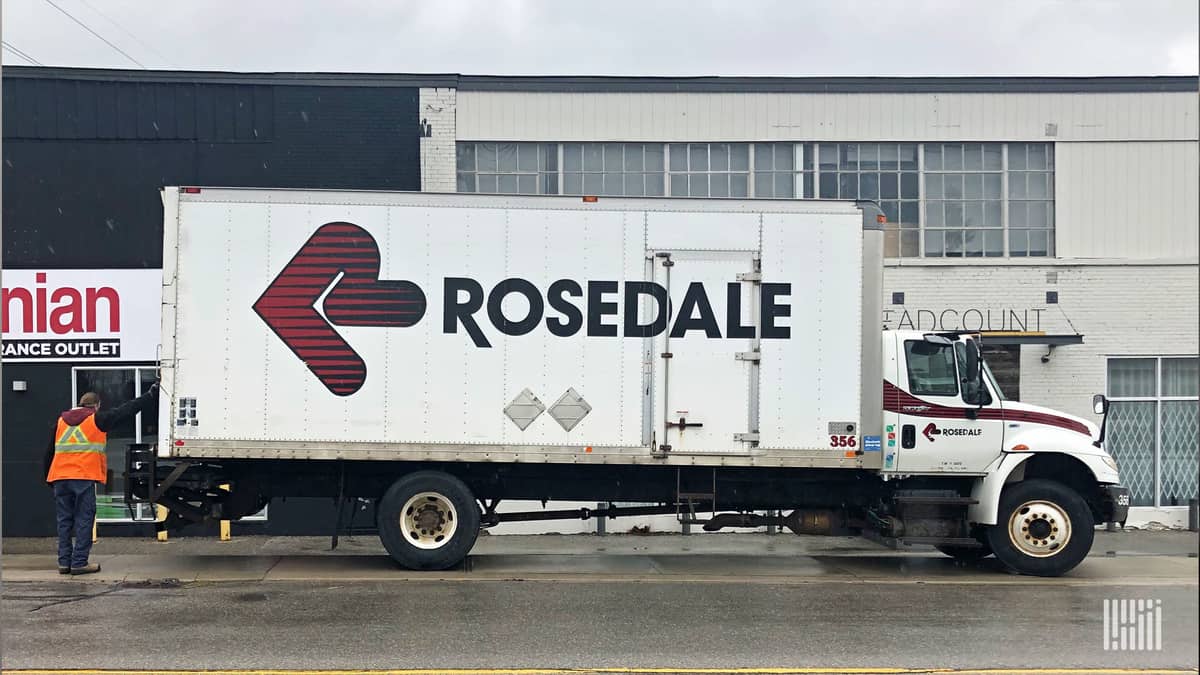 A driver from Rosedale Transportation Group makes a delivery to a carpet store in Toronto