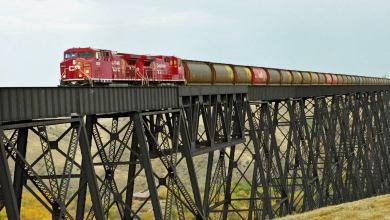 A photograph of a train crossing a bridge.