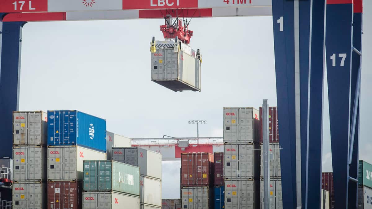 A container being moved by a crane.