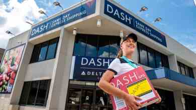 A courier carries a package.