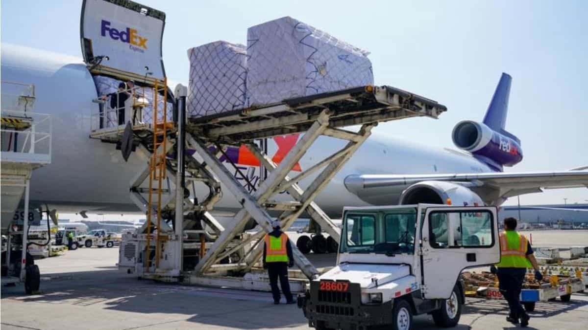 A FedEx plane gets unloaded.