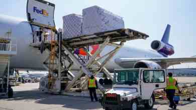 A FedEx plane gets unloaded.