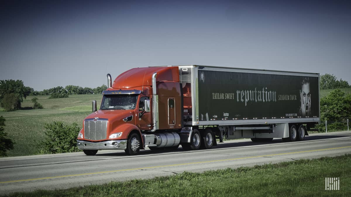 Photo of 18-wheeler truck. On the trailer is a photo of Taylor Swift and the caption "Taylor Swift Reputation."