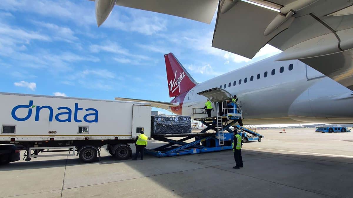 Cargo loaded from truck onto plane.