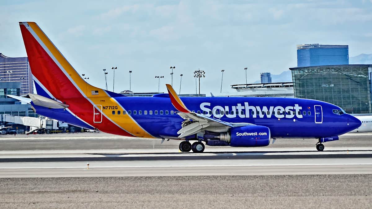 A colorful Southwest Airlines plane on the tarmac.