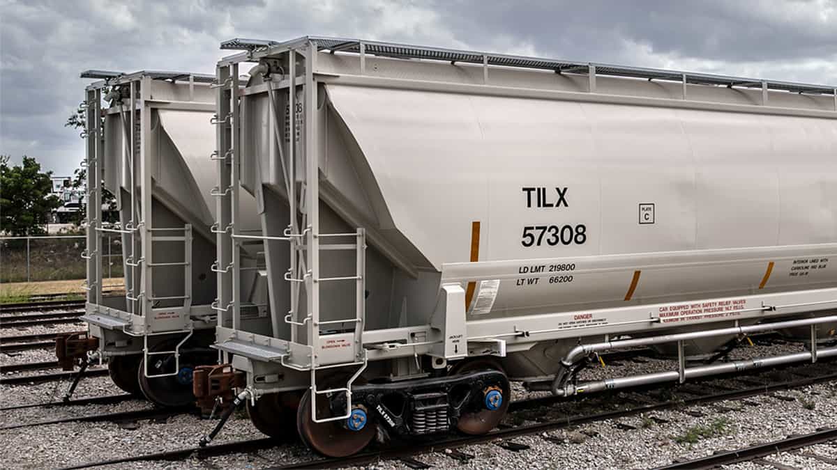 A photograph of two hopper cars for the railroad.