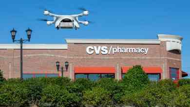 A drone takes off outside a CVS store to make a delivery.
