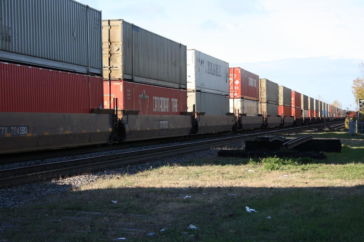 A photograph of intermodal containers on a passing train.