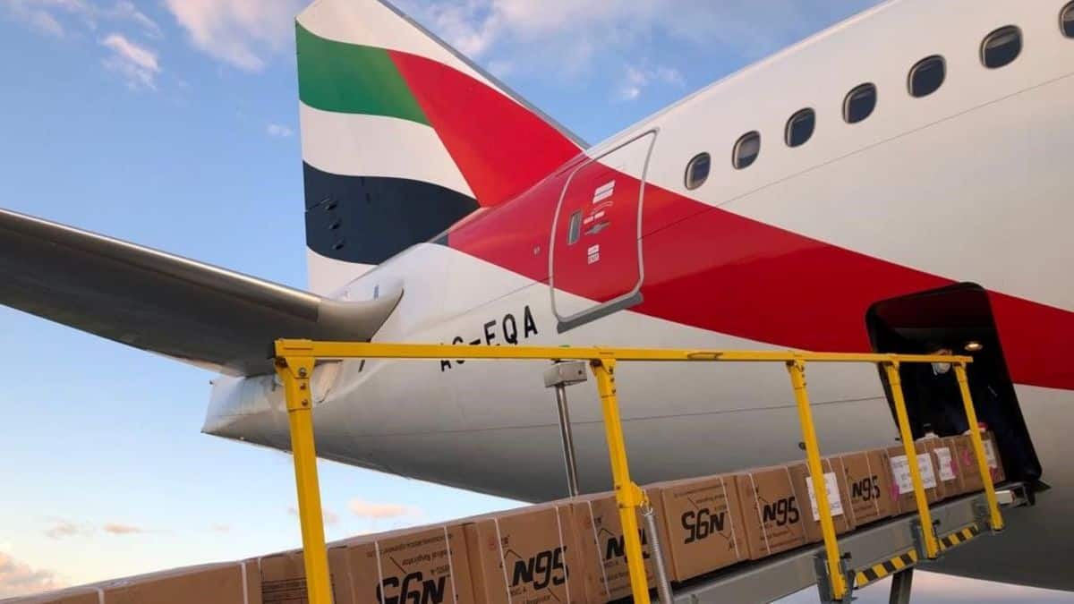 Cargo ets loaded via conveyor belt onto rear of a plane.