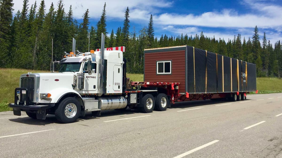 An ENTREC tractor hauls an oversized load.