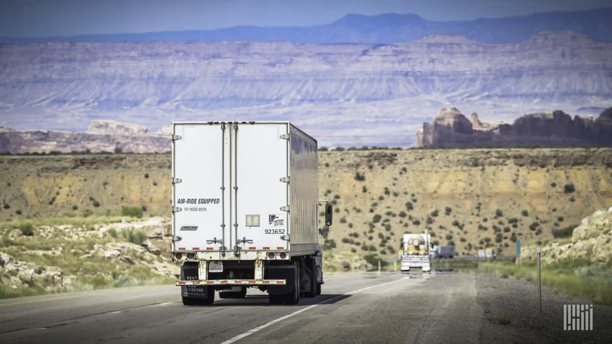 Truck driving on desert highway