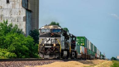 A photograph of a train hauling intermodal contrainers.