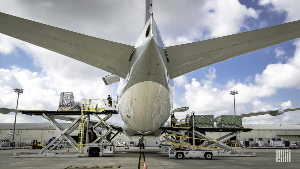 Flight preparations as viewed from behind and below the tail of a big jetliner.