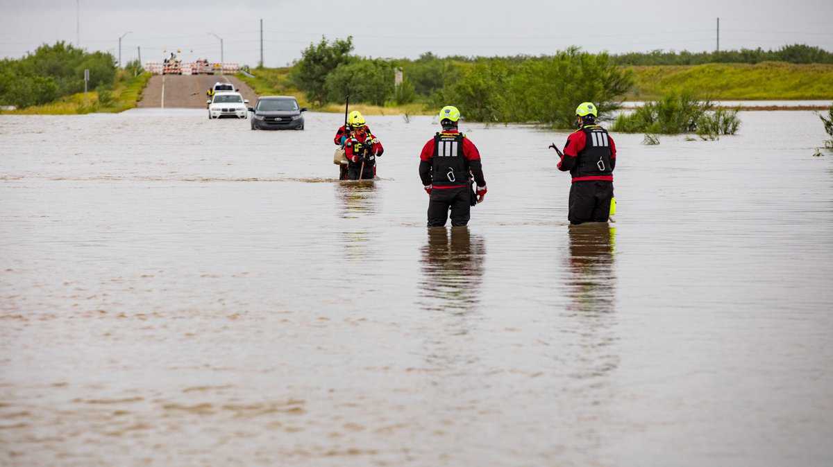 Rescue team in McAllen Texas flood waters.