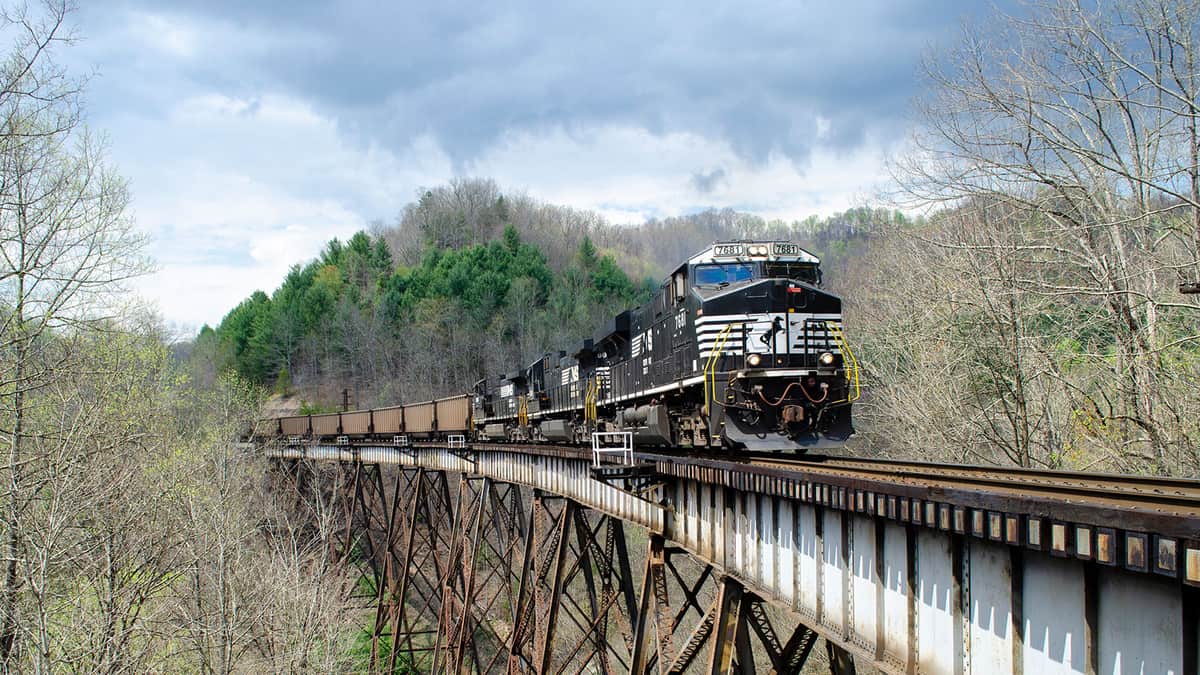 A photograph of a train crossing a bridge.