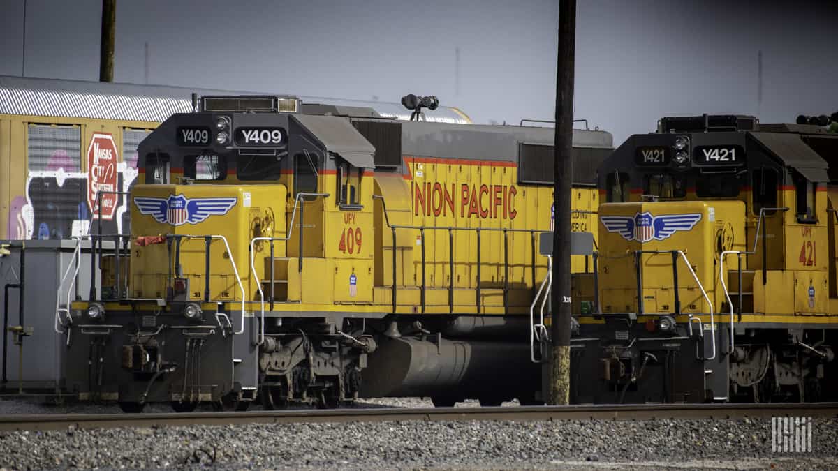 A photograph of a Union Pacific train at a rail yard.