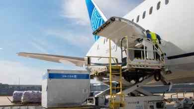 Hydraulic lift platform lifts cargo pallets to door of United Airlines jet. United Airlines has figured out how to make money off of cargo during the pandemic.