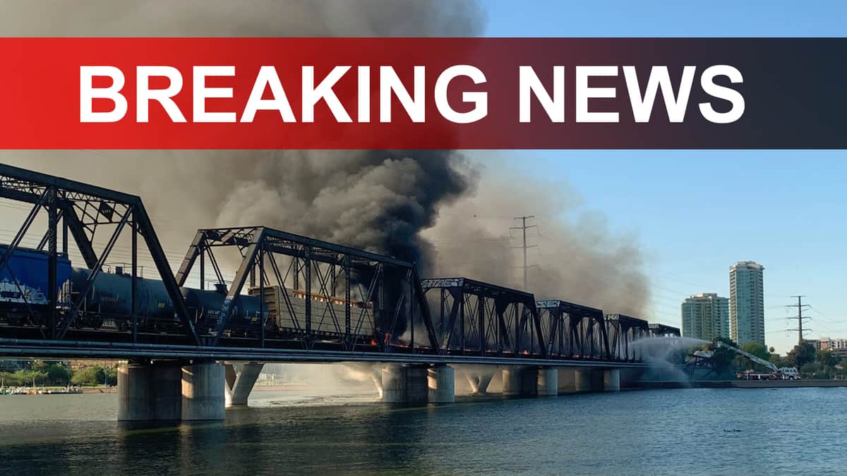 A photograph of a bridge with a large plume of smoke coming from it. The words Breaking News are written on top of the photograph.