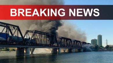 A photograph of a bridge with a large plume of smoke coming from it. The words Breaking News are written on top of the photograph.
