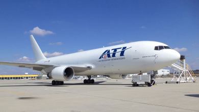 A white jet parked on sunny day. Air Transport International released its earnings Wednesday.