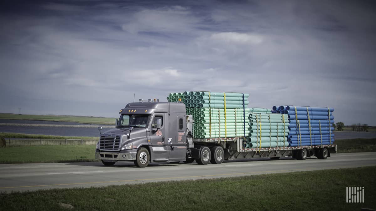 Daseke flatbed rig on highway