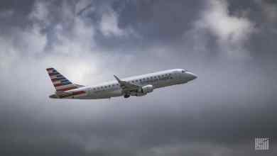 An American Eagle jet on ascent through the clouds. Mesa Airlines operates the jets and will soon fly cargo jets for DHL.