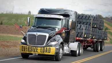 Daseke affiliate truck carrying tires on highway