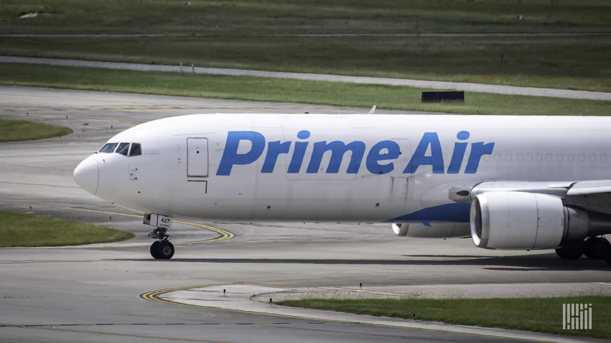 Front-half of a white Amazon jet with the words "Amazon Prime" on the side. Amazon is giving more flying business to ATSG, an air cargo carrier.