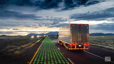 Truck driving on highway at dusk