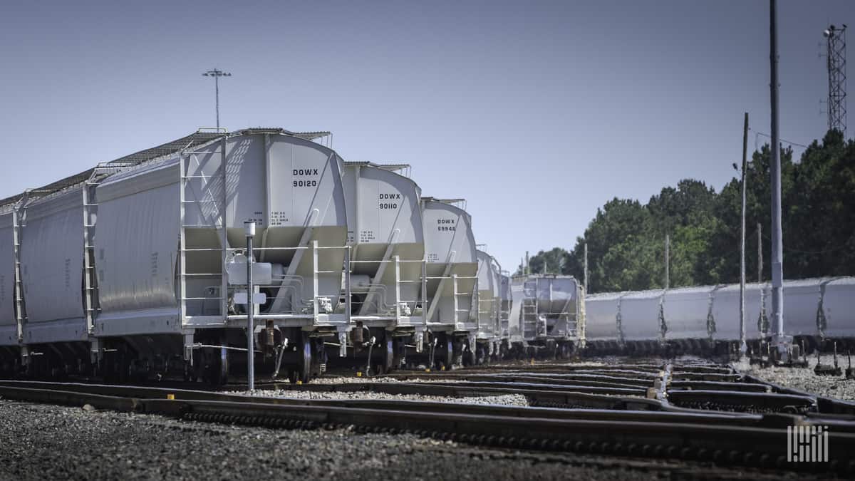 A photograph of railcars parked in a rail yard.