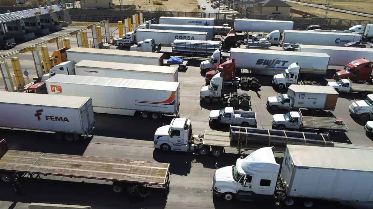 All vehicles leave a carbon footprint. Trucks lined up at the border. (Photo: U.S. Customs & Border Protection)
