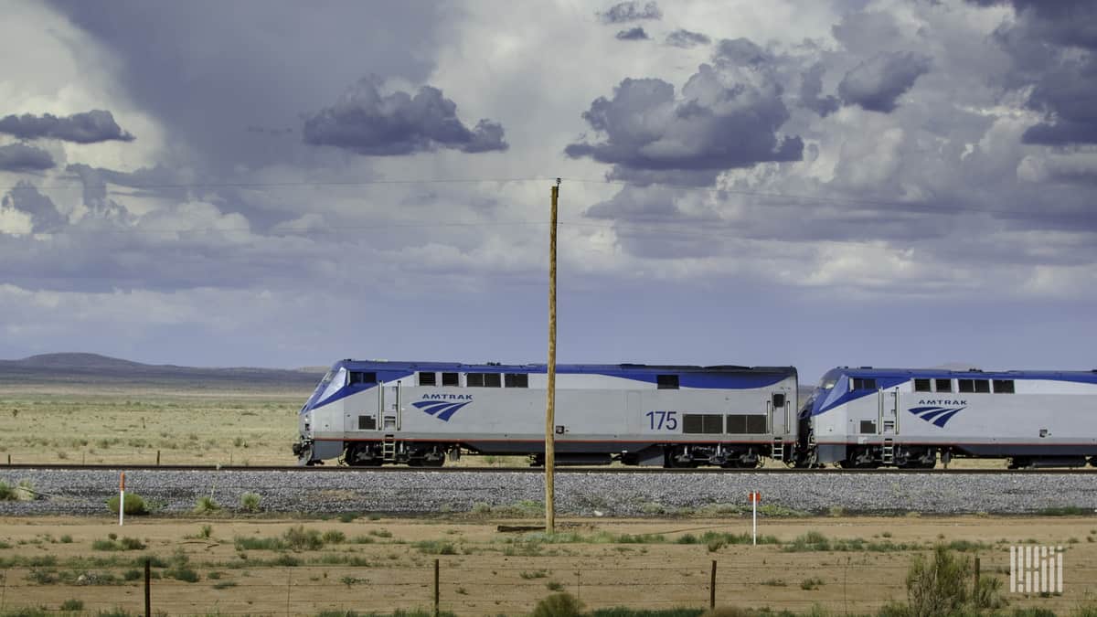 A photograph of an Amtrak train crossing a field.